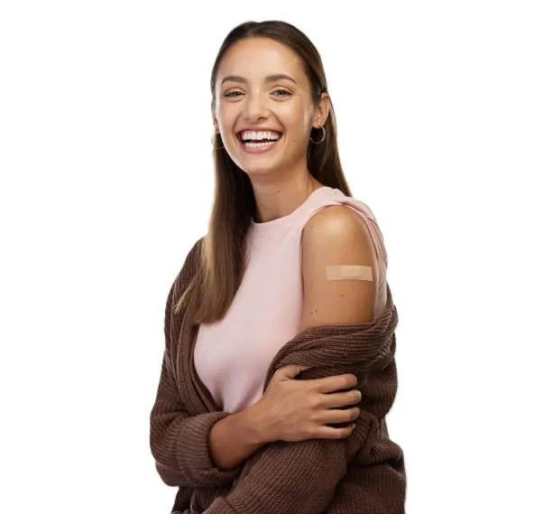 Woman smiling after vaccine with bandaid